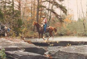 Bill Hinkebein and Country Gold cross a creek at the 1991 Arkansas Traveler NATRC ride near Dover, AR